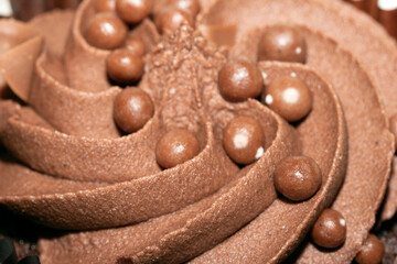 Close Up of Cupcake Cake Icing and Frosting in Chocolate with ball Decoration