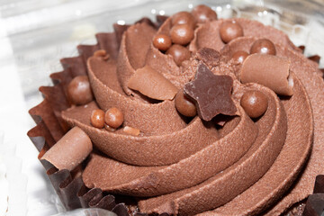 Close Up of Cupcake Cake Icing and Frosting in Chocolate with ball Decoration