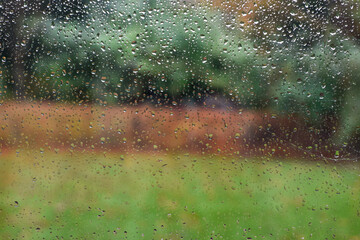 View out of a window on a rainy day with raindrops on the window