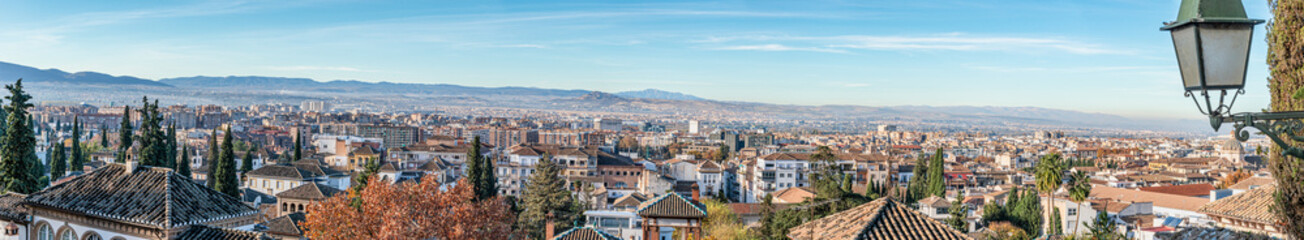 Fototapeta premium Panoramic view (multiple overlapping photos) of a large part of the city of Granada, Andalusia.