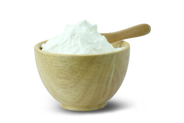 A wooden cup of greek yogurt (yogurt cheese, sack yogurt or kerned yogurt) with a spoon isolated on white background close up with clipping path stack