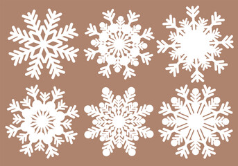 vector set of white snowflakes on a pink background. christmas and new year theme. collection of christmas symbols.