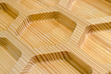 Textured wooden panel with hexagonal cells