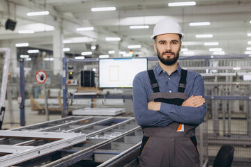 Supervisor overseeing aluminum and PVC windows and doors production line in factory