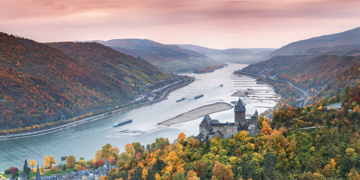 Burg Stahleck castle and river Rhine in autumn at sunrise, Rhineland-Palatinate, Germany