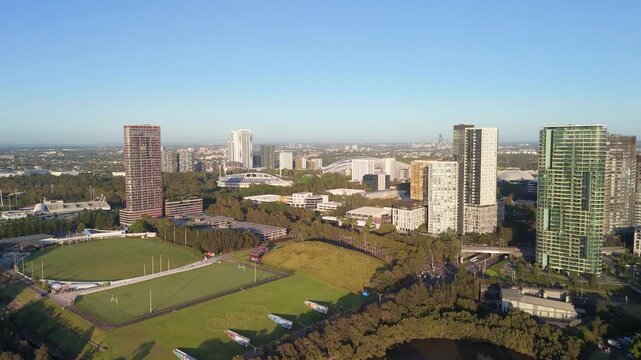 Aerial drone rising up view of the east side of Sydney Olympic Park in Greater Western Sydney NSW, Australia in December 2024