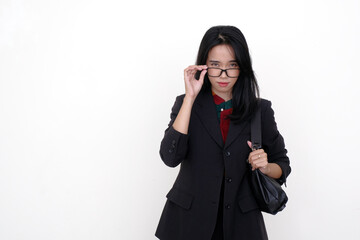 Asian female manager fixing her black eyeglasses trying to read a business announcement