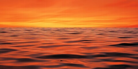 Fototapeta premium Vibrant Sunset Over Calm Ocean Water with Beautiful Color Palette