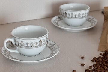 Discover our collection of Elegant Coffee Cups showcasing a Decorative Design paired with a Saucer