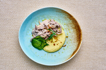 A plate of food with a blue plate and a brown plate