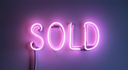 Neon sign that says sold on a wall with a cord