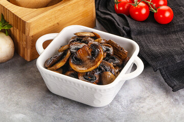 Roasted champignon mushrooms in the bowl