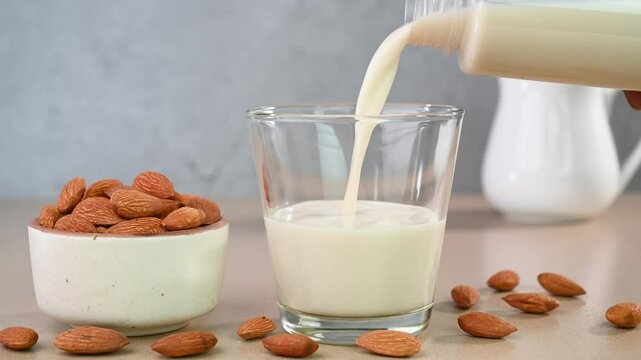 Serving almond milk in a glass cup.