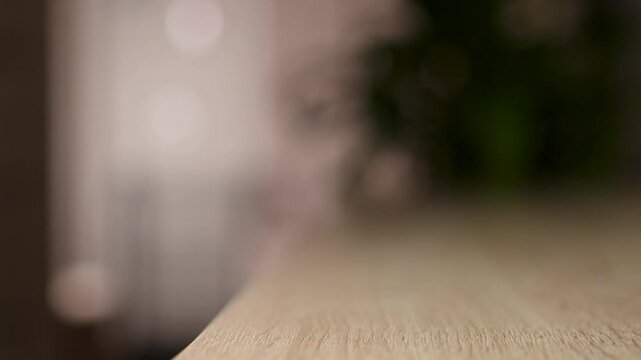 Woman pick up money wallet from table, close-up. Female hand taking purse while leaving home