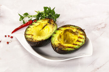 Sliced fresh avocado on the grill