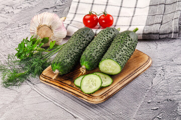 Raw green cucumbers with slices