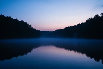 Fototapeta premium A calm lake with a beautiful blue sky in the background