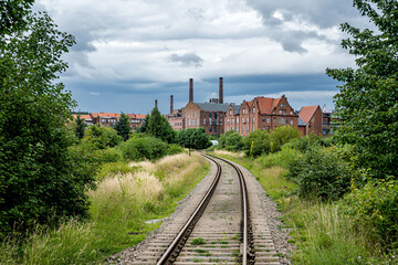 Fototapeta premium rail yard at metallurgical plant, cargo containers, industrial haze