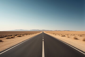 Fototapeta premium arafed road in the middle of a desert with mountains in the distance