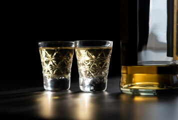 Two Shots Of Georgian ChaCha Brandy. Two shots of ChaCha in the harsh light. ChaCha in crystal glass.