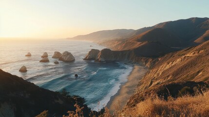 Sunset over dramatic Pacific coastline, rocky cliffs, sandy beach, ocean waves.