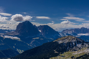 Aerial view of the mountain silhouettes on the horizon. Misty and foggy sky with Dolomites mountain range on the horizon. Blue mist in the mountains