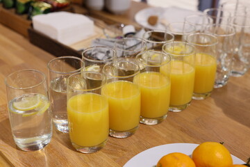 A Beautifully Arranged Refreshing Display of Orange Juice and Water for All Occasions