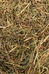 a pile of green straw for long-term storage