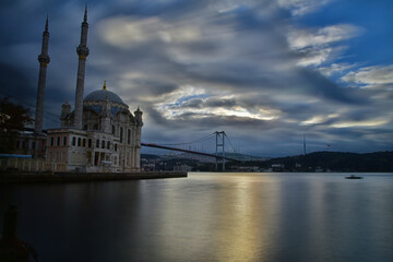 View of Ortakoy Mosque and July 15 Martyrs Bridge in the morning. View of the July 15 Martyrs Bridge (Bosphorus Bridge) and Camlıca Mosque at sunrise.