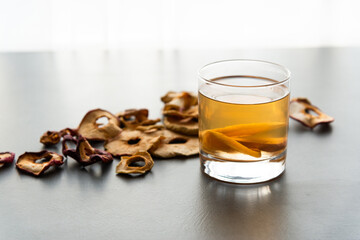 Dried apple compote. Stewed fruit drink on the kitchen table. Natural homemade fruit compote.