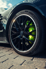 Front wheel of modern car with a rims and tyre