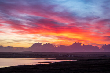 Fototapeta premium Colourful sunrise over sea loch