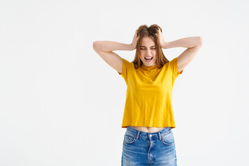 Worried young woman with hair loss problem isolated on white background