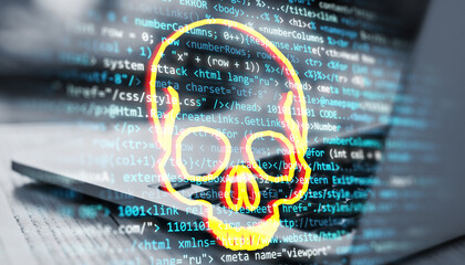 Skull symbol overlaying computer code on screen, indicating cybersecurity threat or malware warning in digital environment.
