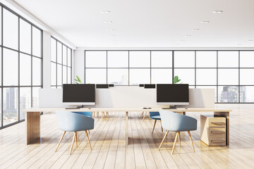 Modern office interior with wooden desks, blue chairs, and large windows offering a city view. Bright, clean, professional workspace. 3D Rendering