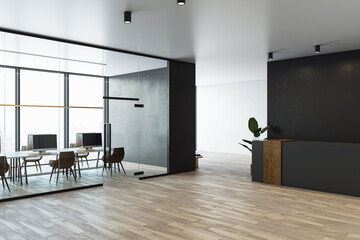 Modern office interior with meeting room, glass partitions, reception desk, and wooden flooring in...