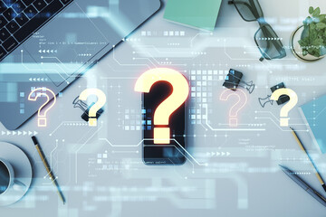 Business workspace with question mark holograms overlay on technology background concept.