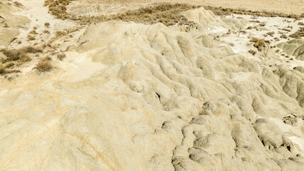 Aerial view of the Calanchi near Pisticci, in the province of Matera, Basilicata, Italy. Badlands are a type of dry terrain where sedimentary rocks and clay-rich soils have been eroded away.