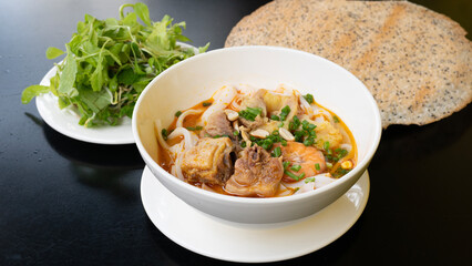Vietnamese noodle Mi Quang. Mi Quang, Vietnamese rice noodles with meat, chicken stock, shrimp, egg, Vietnamese food.