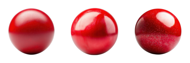 Three glossy red decorative eggs on a black background