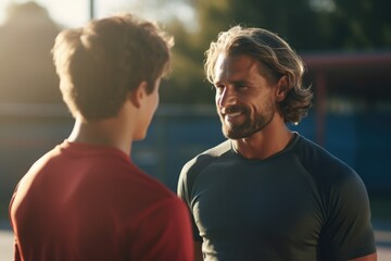 Obraz premium man. coach. child. father and son. conversation. education. friendly conversation. parenting