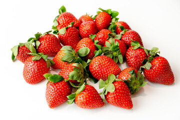 Red ripe organic strawberries on white background. Close up.