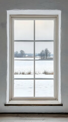 A snowy landscape viewed through a large window, creating a serene indoor atmosphere.