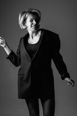 Portrait of a young beautiful girl in the studio. Black and white photo.