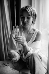 Portrait of a young beautiful girl in the studio. Black and white photo.