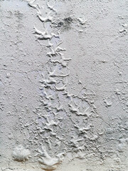 The blistered surface of cement wall. Swollen color wall from the moisture. Cracked wall, Paint...