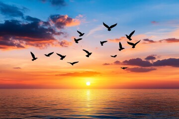 A flock of birds flying across a sunset sky, symbolizing freedom and limitless possibilities