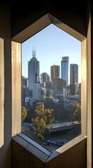 Fototapeta premium View of a city skyline through a hexagonal window, showcasing modern architecture and nature.