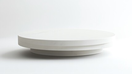 Minimalist white plate on a clean surface, perfect for displaying culinary creations or modern table settings.