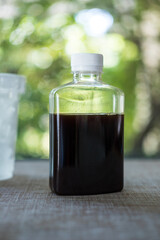 A bottle of black coffee cold beverages drink, fresh breakfast refreshments drink on table